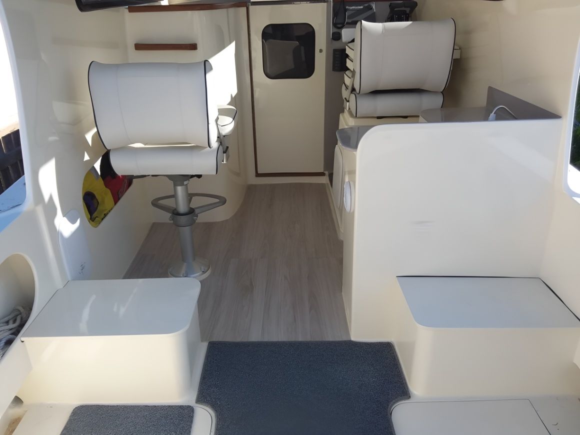 The Inside of a Boat With White Seats and a Door — Sandy Straits Marine In Urangan, QLD