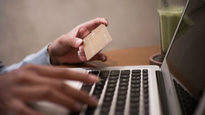 Holding Credit Card While Typing — Santa Barbara, CA — Law Offices of Karen L. Grant