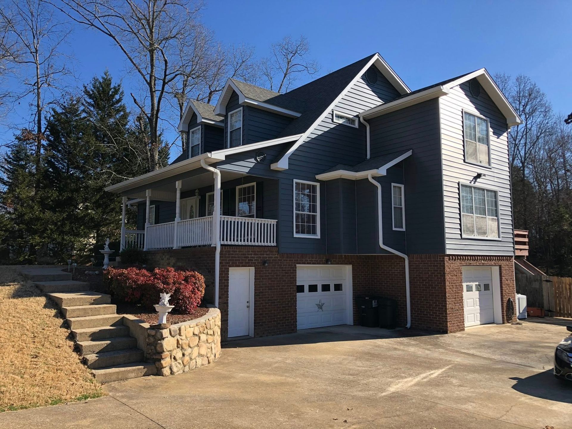 A large house with a car parked in front of it.