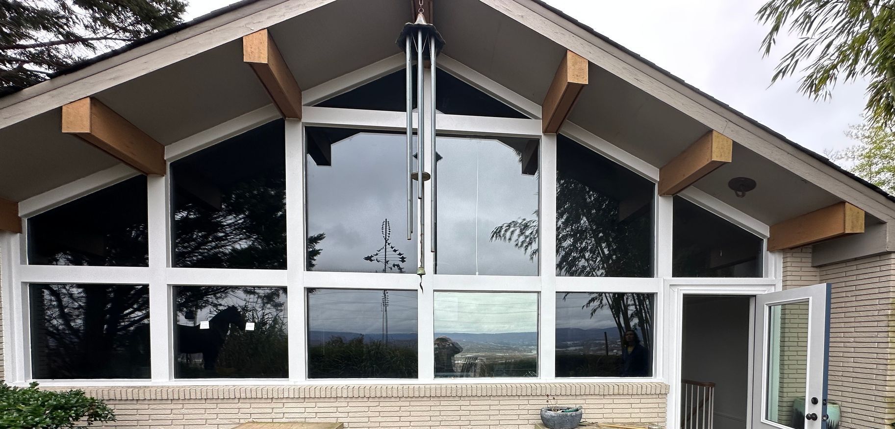 A house with a roof that has a lot of windows