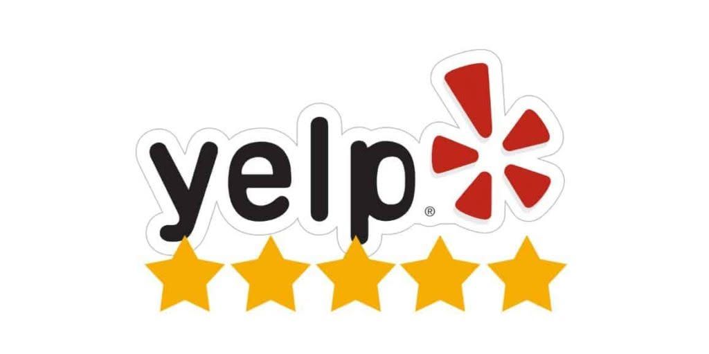 A yelp logo with a red star on a white background.