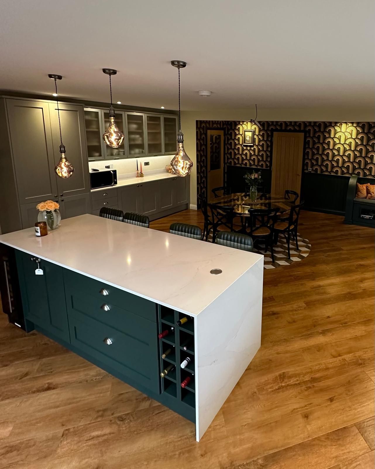 There is a large island in the middle of the kitchen.