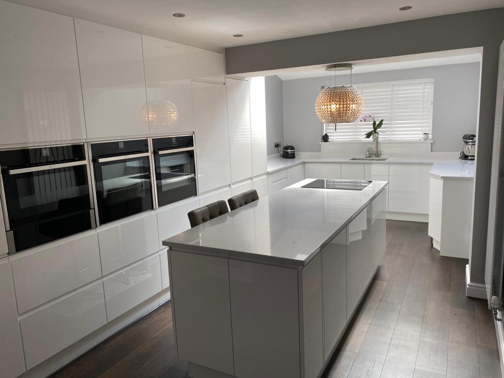 There is a large island in the middle of the kitchen.