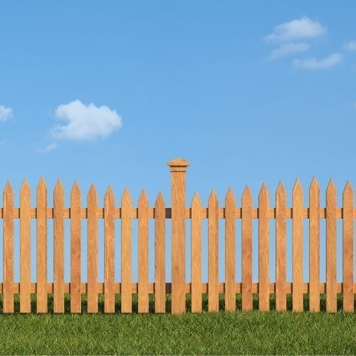 This is a picture of a wooden picket fence done by Leicester Fencing