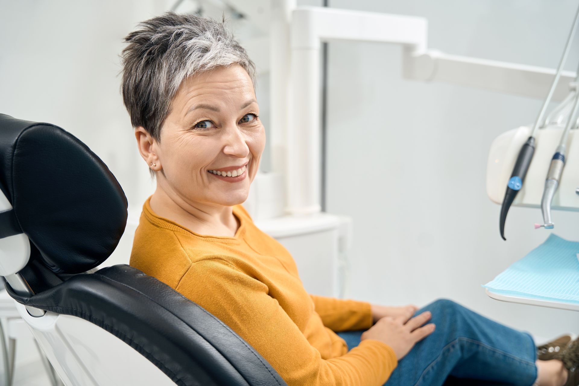 Woman smiles in a dental chair at Snowy River Dental in Bellevue, ID 83313