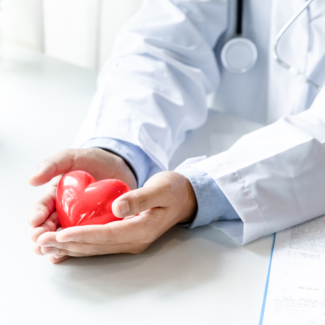 picture of medical provider's hands holding a heart