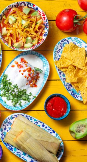 There are many different types of mexican food on the table.