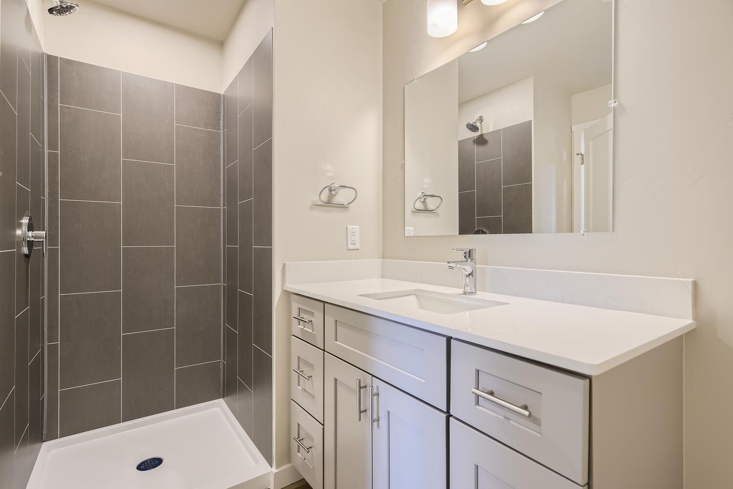 a bathroom with a sink and a walk in shower