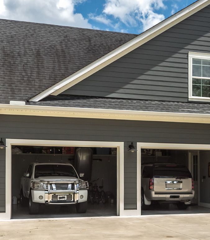 House with cars parked in the garage.