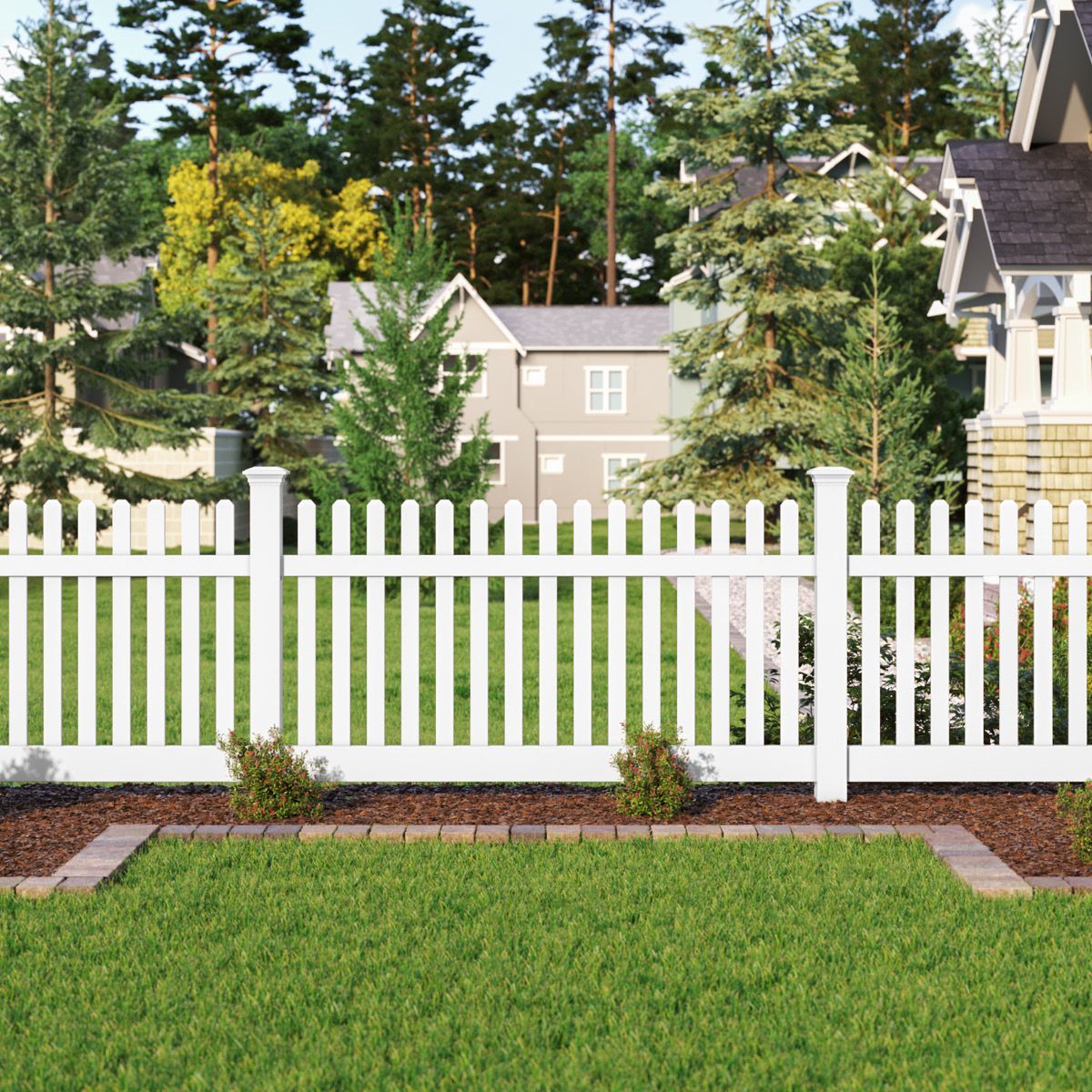 A white picket fence surrounds a lush green yard in front of a house.