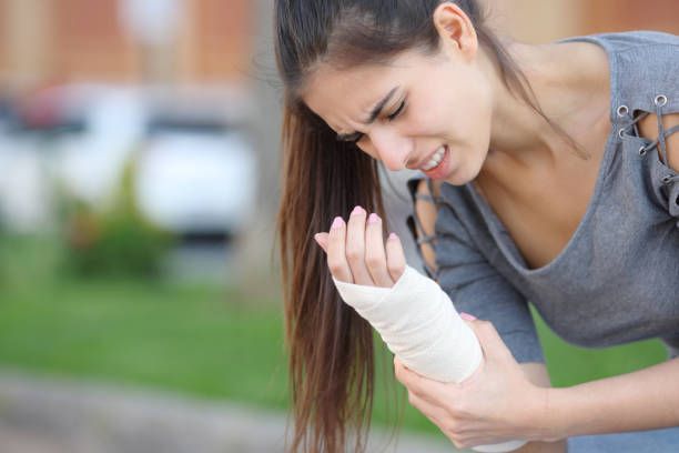 Sunrise Hospital. Patient-133, stock photo of a woman in pain due to a broken wrist