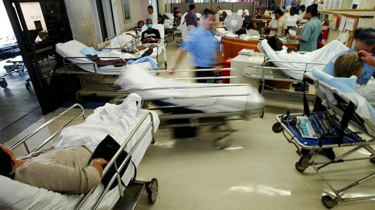 Sunrise Hospital, Patient-182, stock photo of patients on gurneys in a crowded hallway