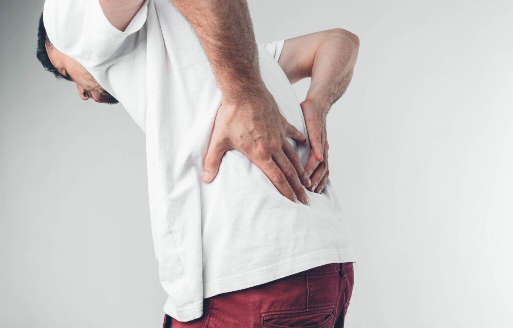 Sunrise Hospital. Patient-4, stock photo of young man with back pain