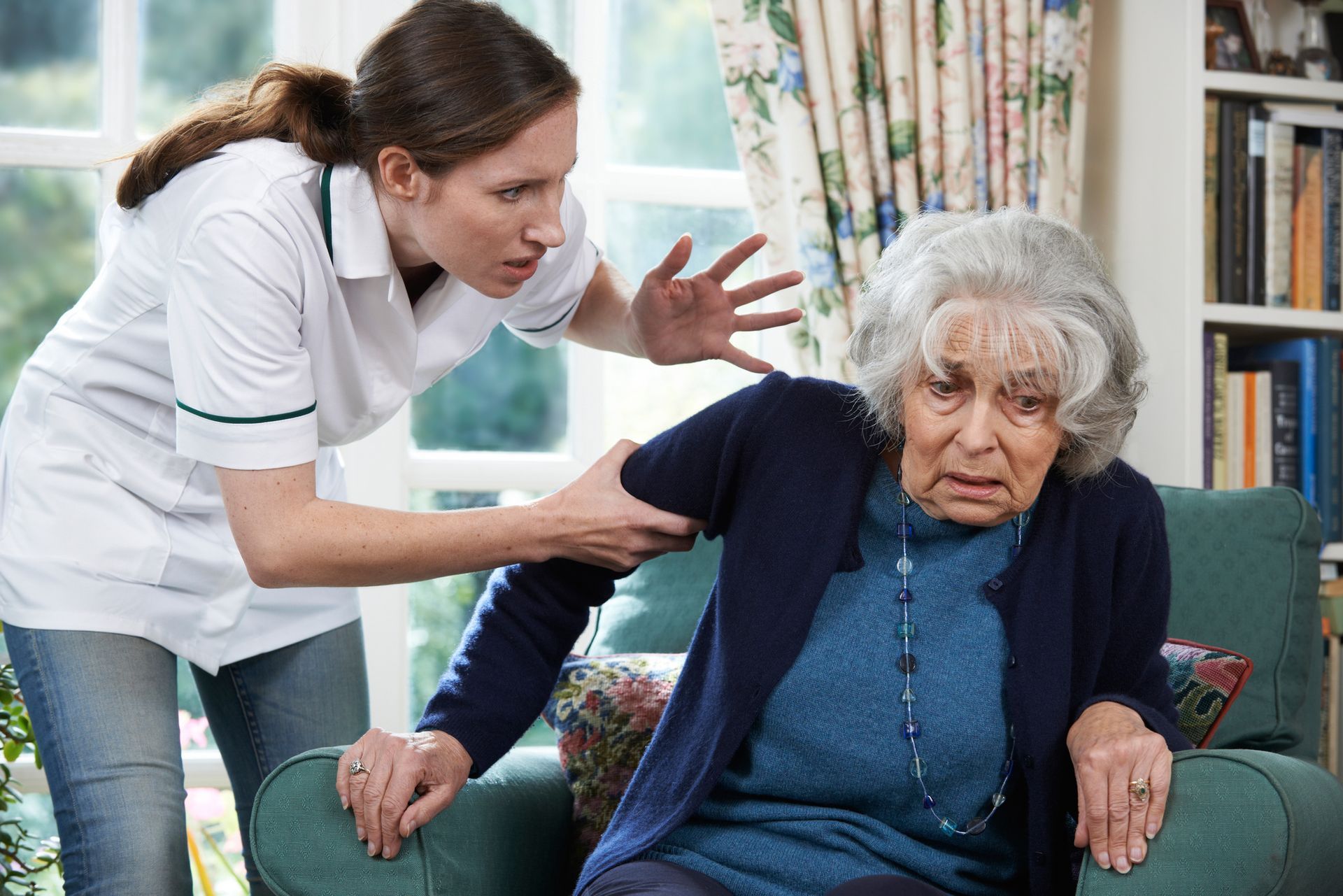 Stock photo of a nurse threatening a patient