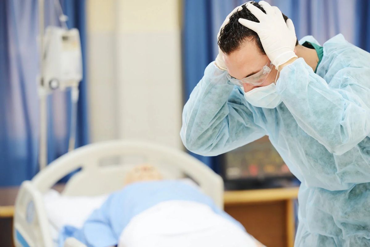Sunrise Hospital. Patient-9, stock photo of doctor reacting to surgical error