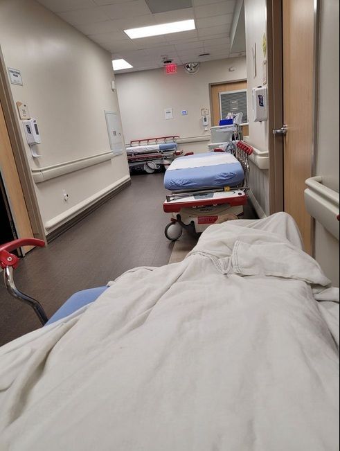 Sunrise Hospital, photo of a woman left on a gurney in the cold hallway, without pillows