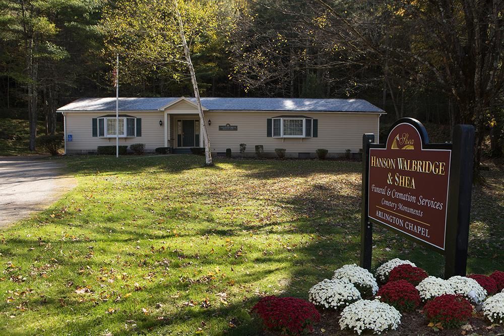 A house with a sign in front of it that says ' warrior ' on it