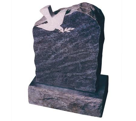 A gravestone with a dove carved into it