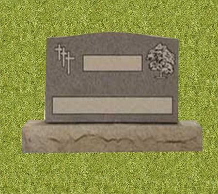 A gravestone with a cross and a tree on it is sitting on top of a grass covered field.