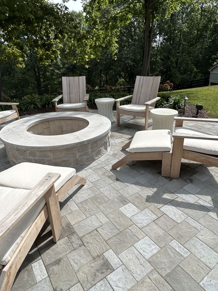 There is a fire pit in the middle of the patio.