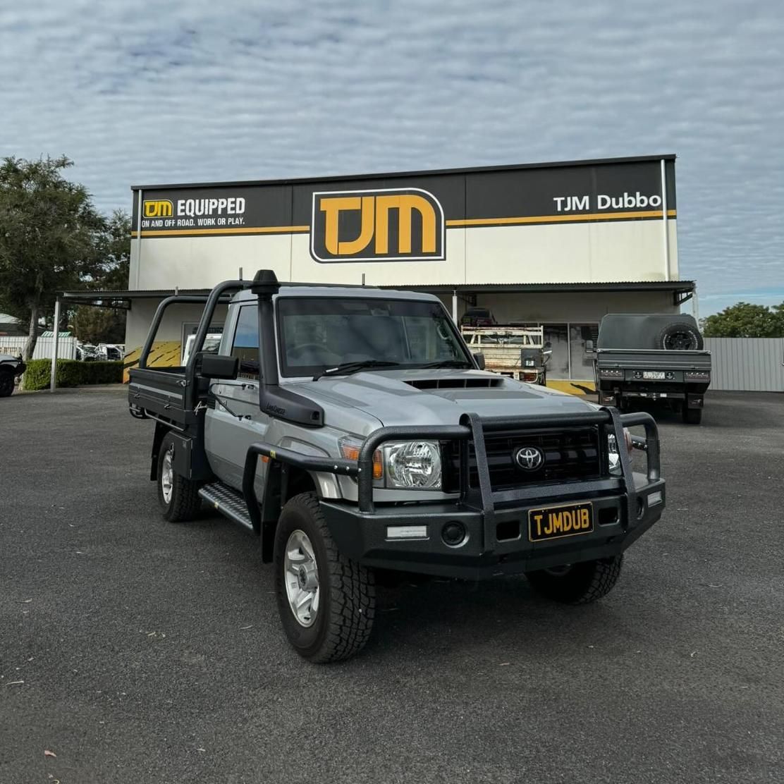 A Silver Truck Is Parked In Front Of A Building — TJM Dubbo In Bourke, NSW