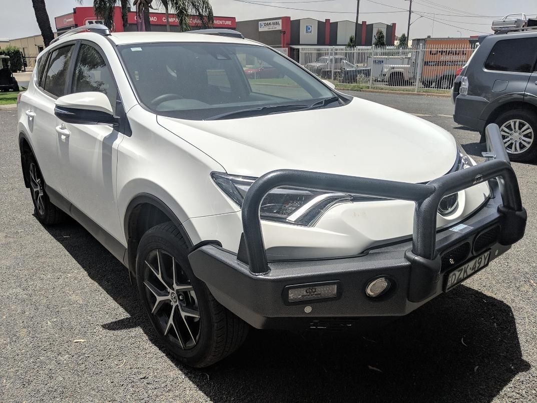 A White Car With A Black Bumper Is Parked On The Side Of The Road — TJM Dubbo In Cobar, NSW