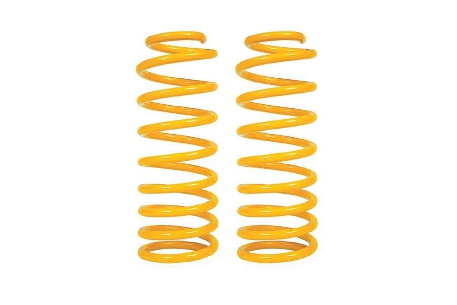 A Pair of Yellow Coil Springs on a White Background — TJM Dubbo In Dubbo, NSW