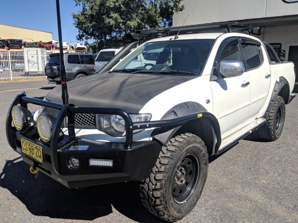 A White Truck With A Black Bumper Is Parked In A Parking Lot — TJM Dubbo In Condobolin, NSW