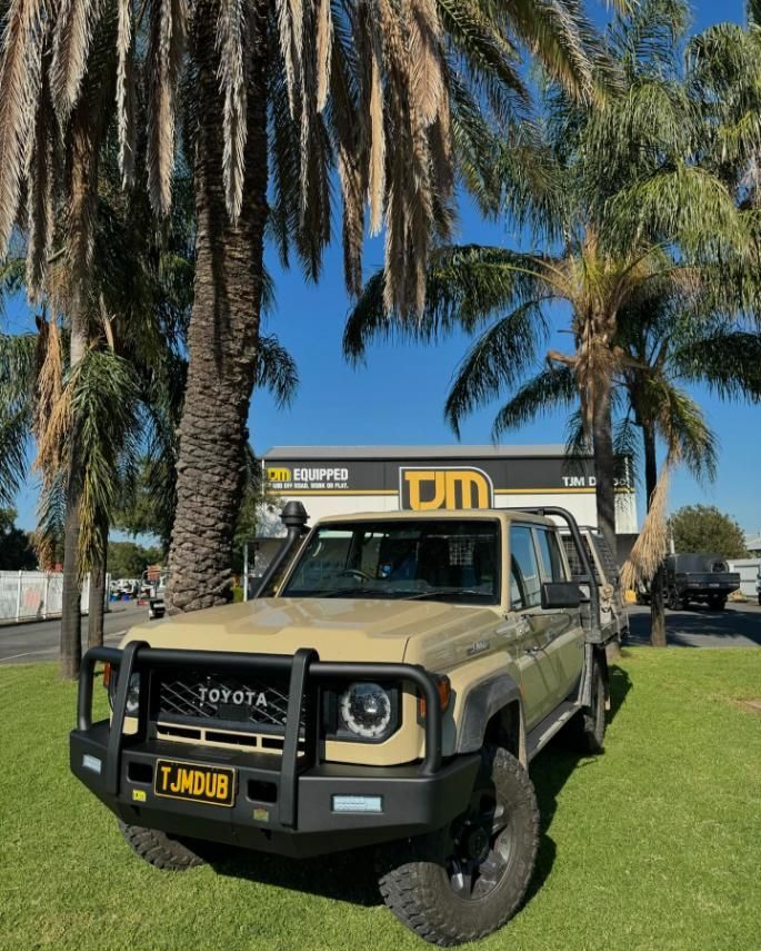 A Toyota Truck Is Parked In Front Of A Palm Tree — TJM Dubbo In Narromine, NSW