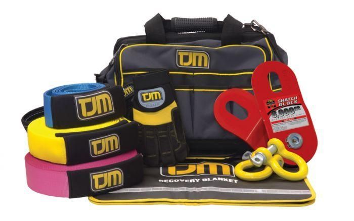 A Bag With TJM Written On It Sits Next To A Bunch Of Tools — TJM Dubbo In Dubbo, NSW