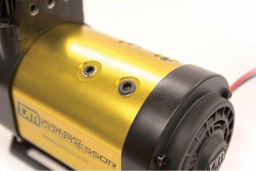 A Close Up Of A Black And Gold Air Compressor On A White Background — TJM Dubbo In Dubbo, NSW