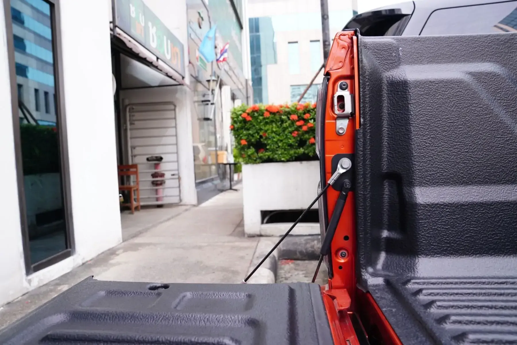 A Pickup Truck is Parked on the Side of the Road in Front of a Building — TJM Dubbo In Dubbo, NSW