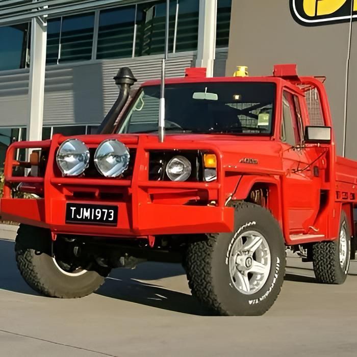 A Red Truck With A License Plate That Says TJM1973 — TJM Dubbo In Walgett, NSW