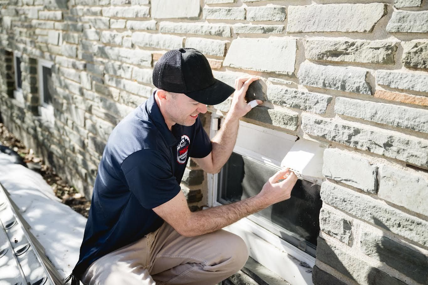 Technician cleaning a dryer vent