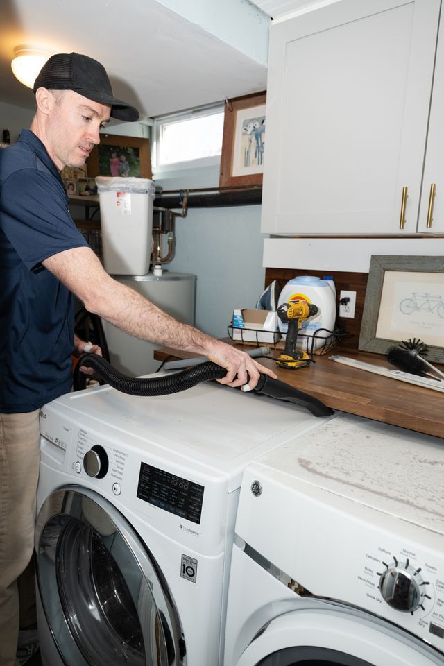 technician doing dryer vent cleaning
