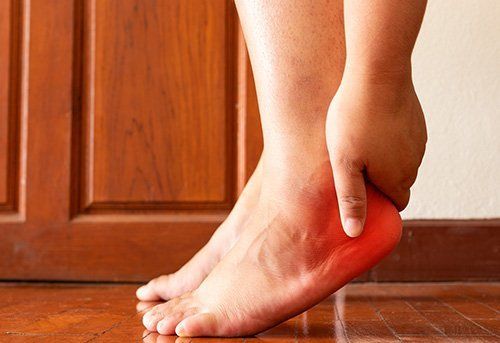 Hand Holding Foot — Pensacola, FL — Pensacola Podiatry P.A.