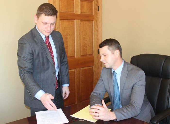 The Attorneys of Cline, Braddock & Basinger Working on a Case. Call to Schedule a Consultation.