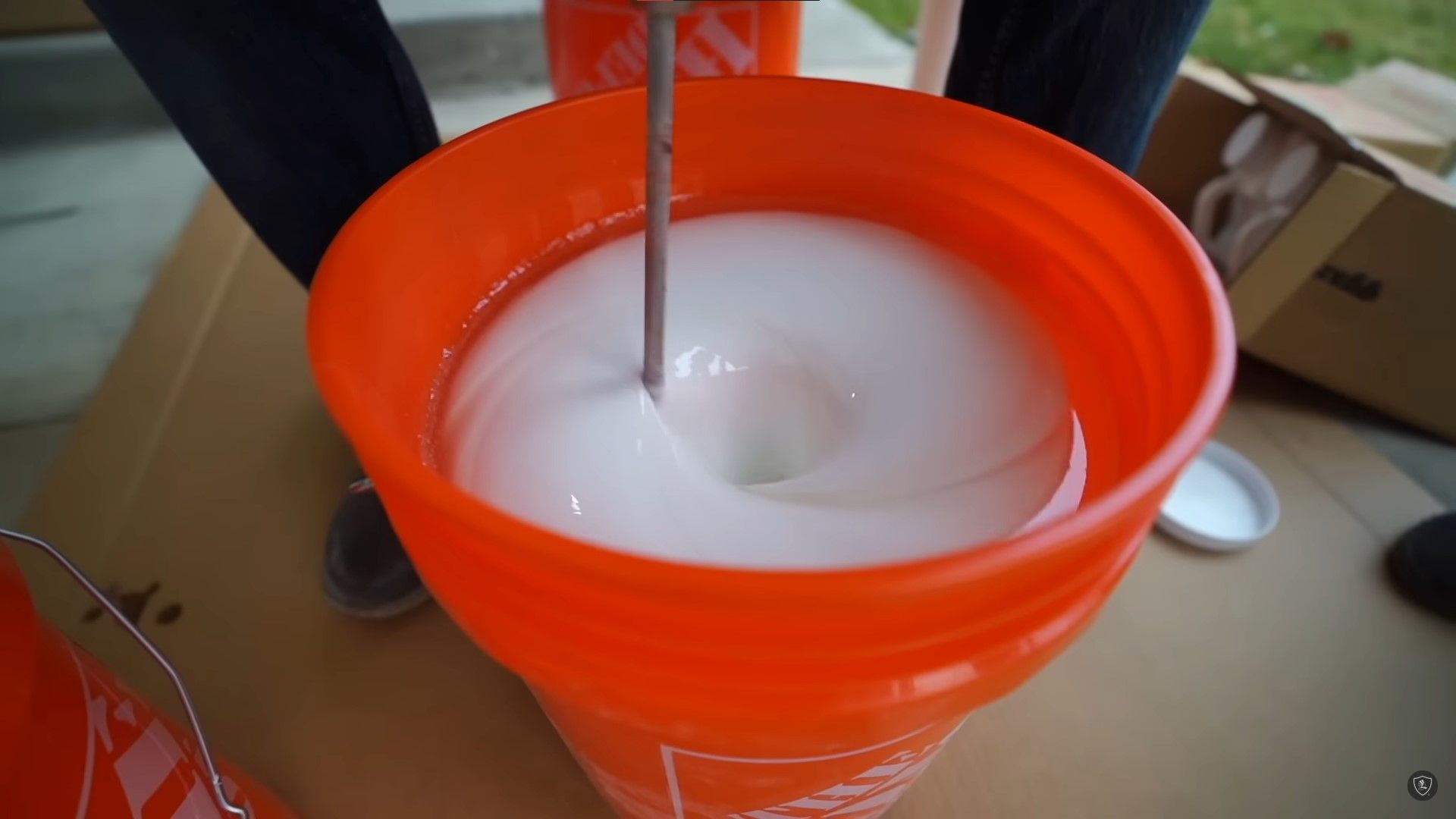 mixing epoxy paint in orange bucket