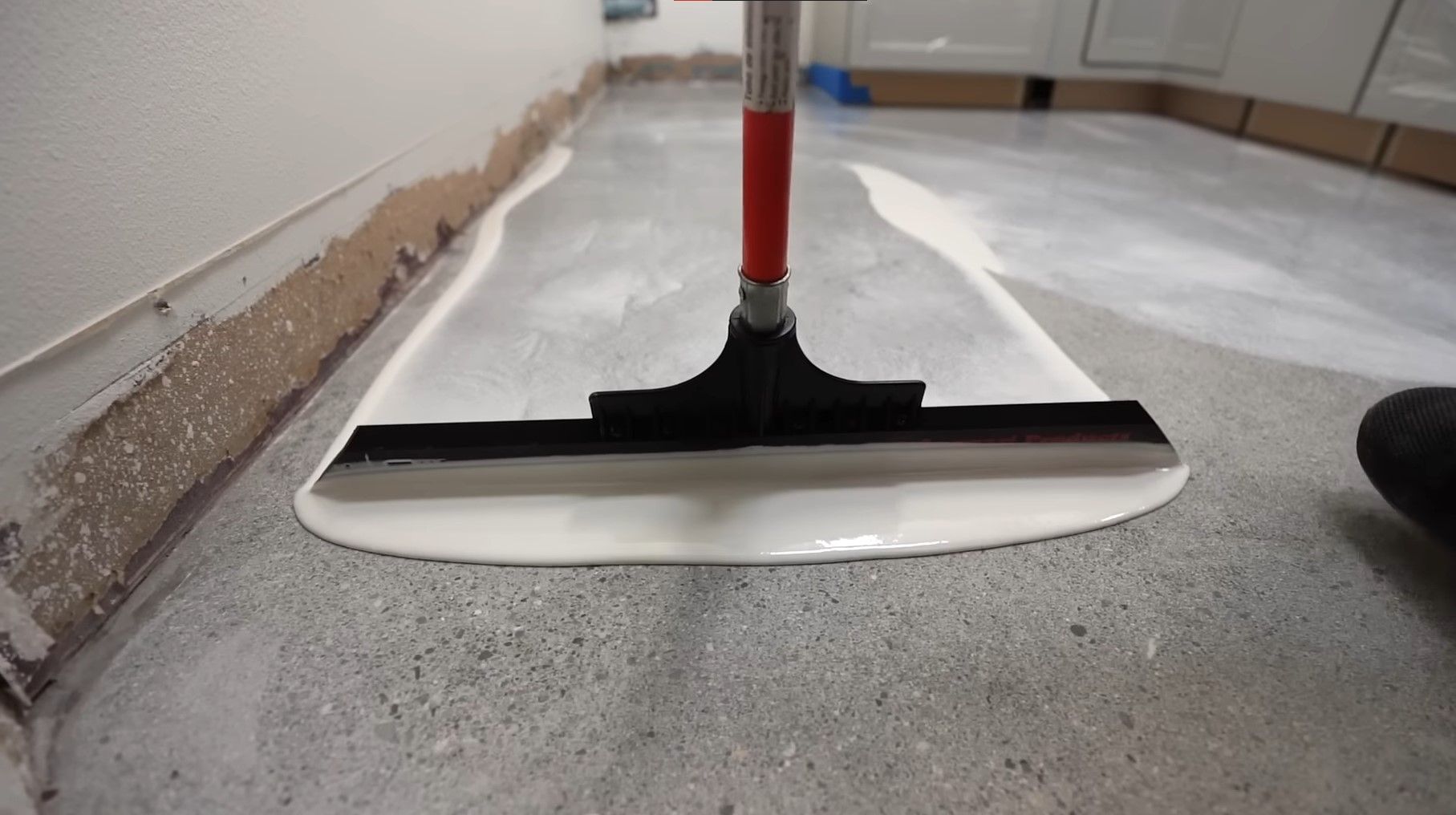 squiggly epoxy white paint over floor