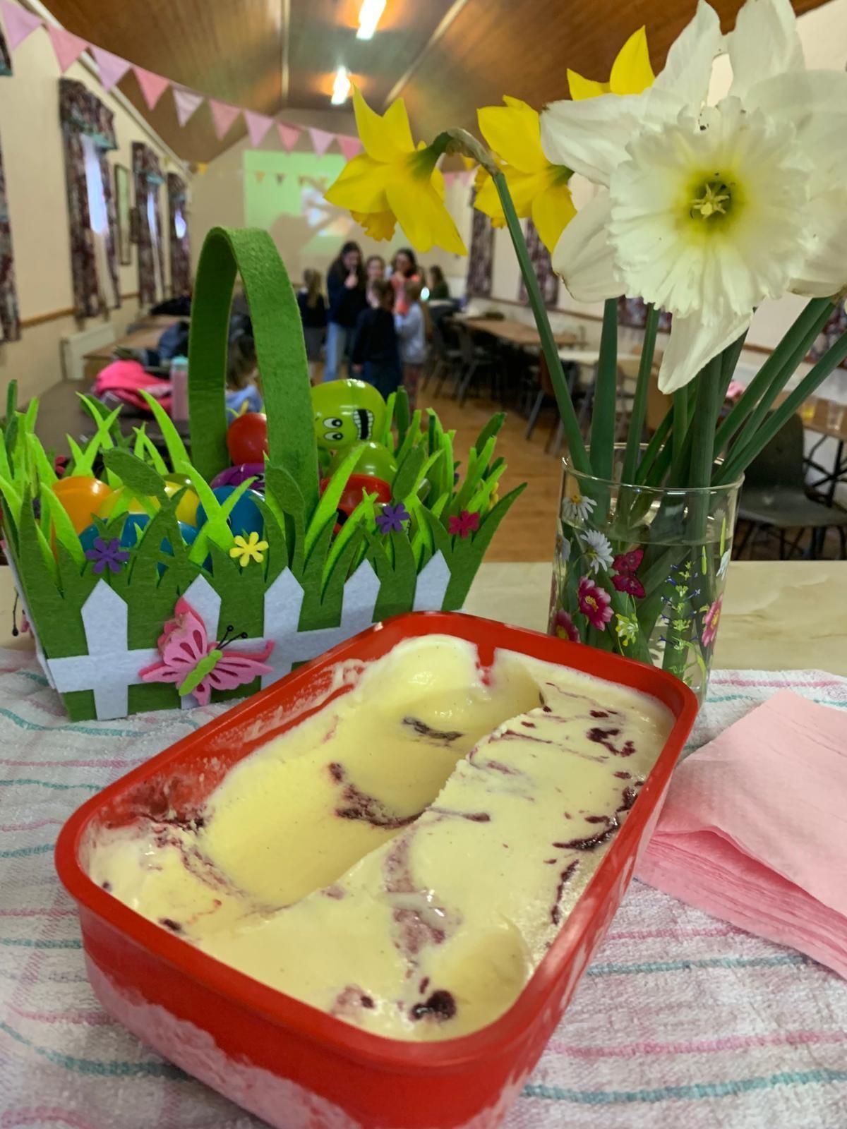 Dessert tray on a table with spring decorations and flowers in a festive indoor setting
