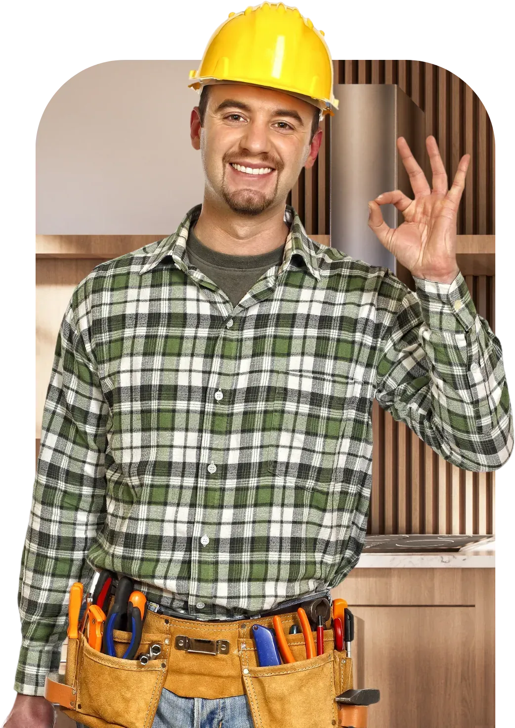 Man with tool belt giving a thumbs up in a kitchen.
