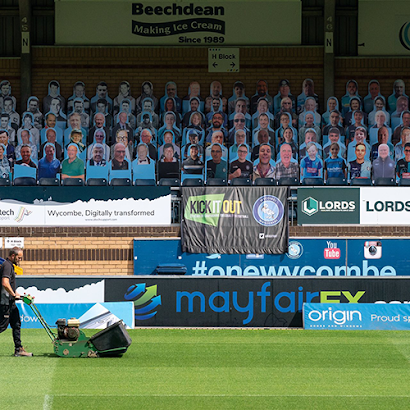 A soccer field with a sign that says mayfair on it