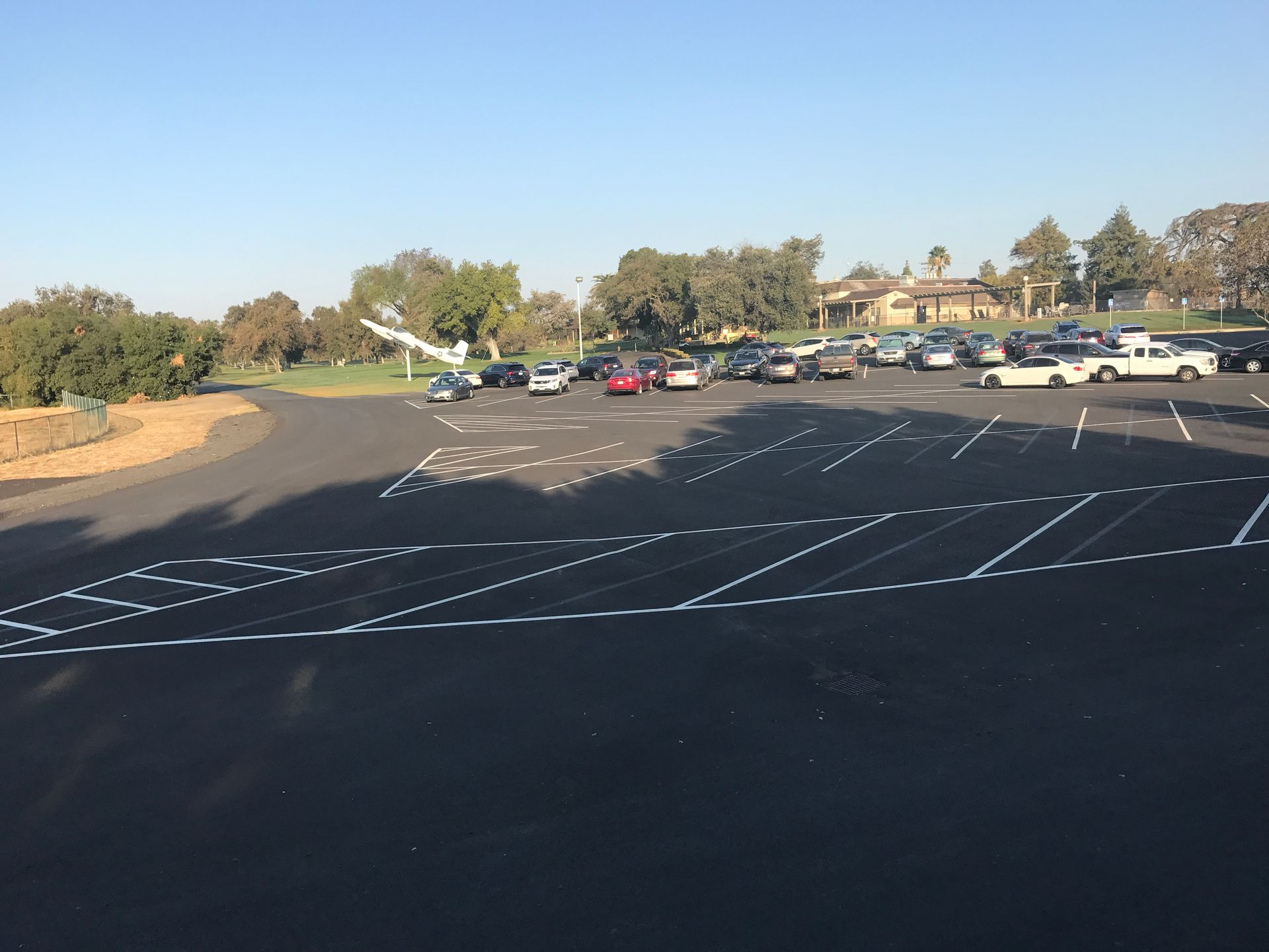 A lot of cars are parked in a parking lot