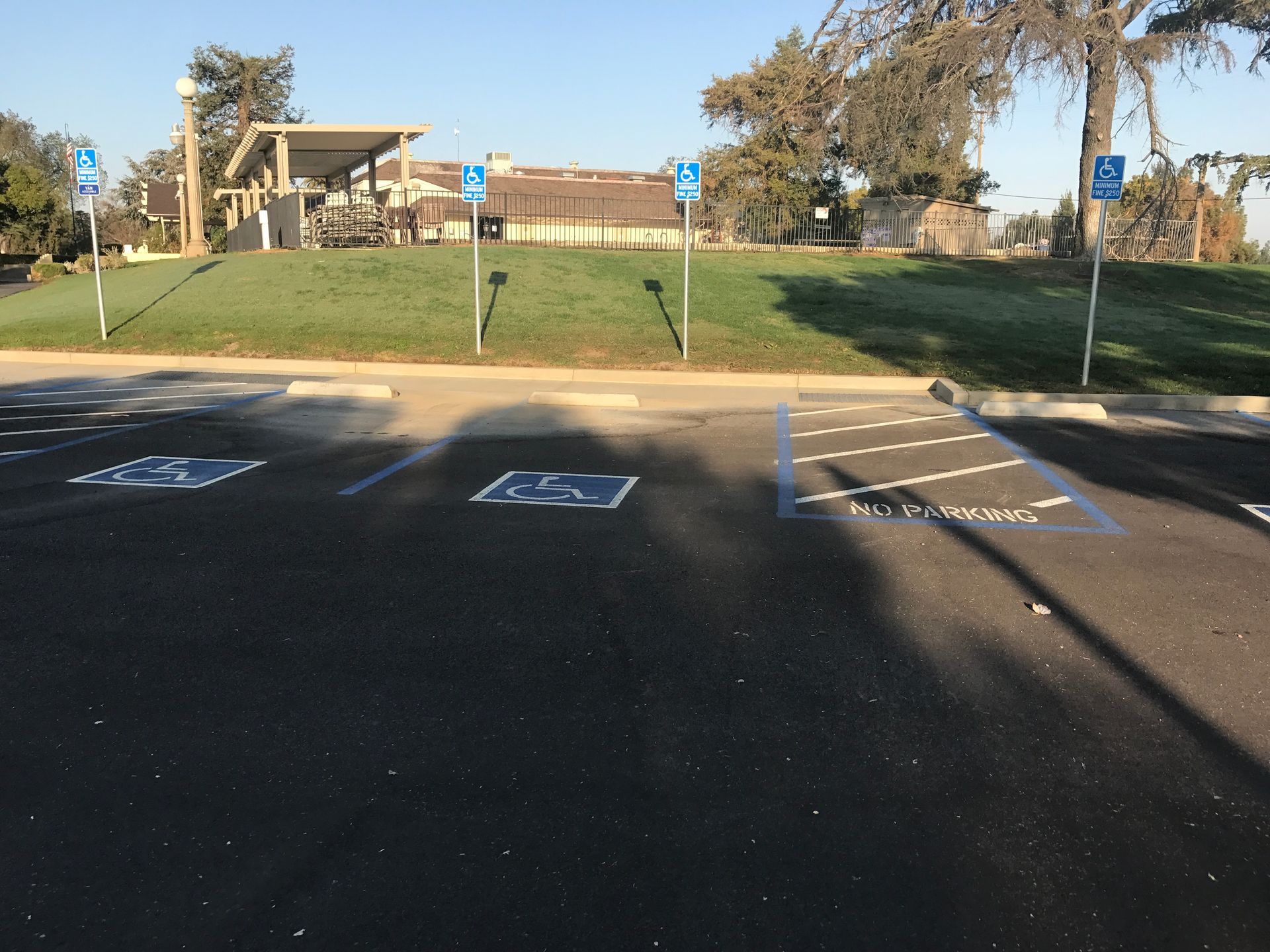 A handicapped parking spot in a parking lot