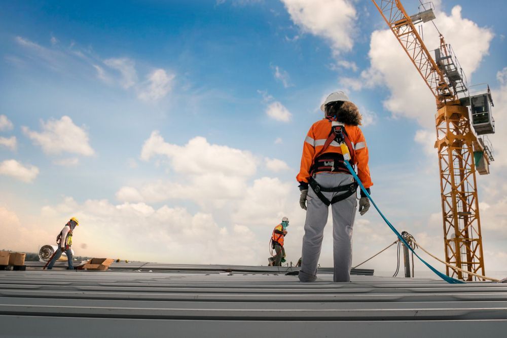 Construction Worker on a Rooftop — C&A Roofing In Tamworth, NSW