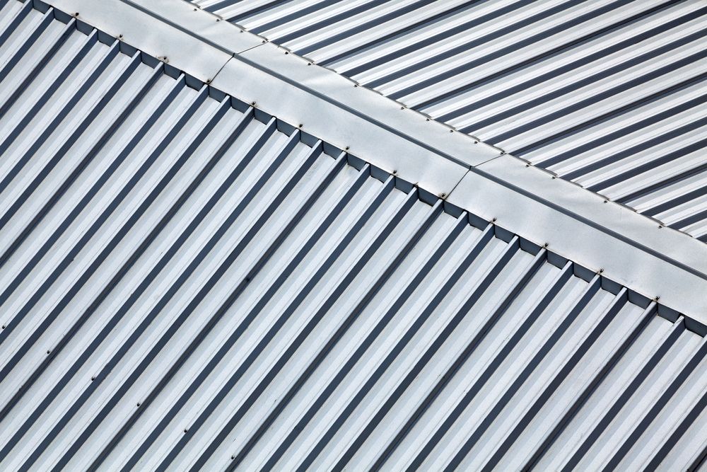 Metallic Corrugated Roof With Angled Ridges — C&A Roofing In Taree, NSW