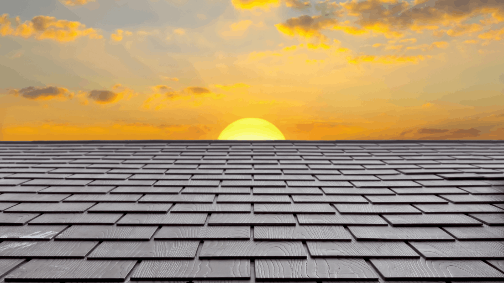 Wooden shingle roof stretching towards a setting sun; orange and yellow sky with clouds — C&A Roofing In Tweed Heads, NSW