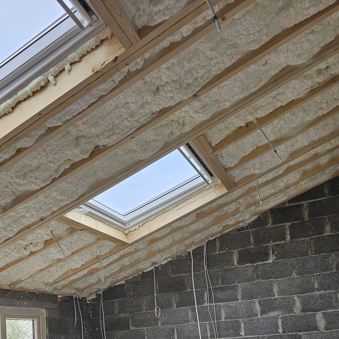 A room with a skylight in the ceiling