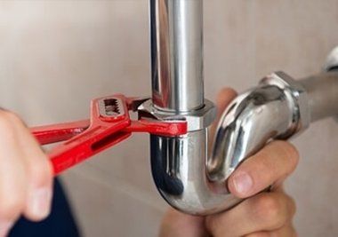 Plumber Fixing Sink Pipe — Plumbers in Forster, NSW