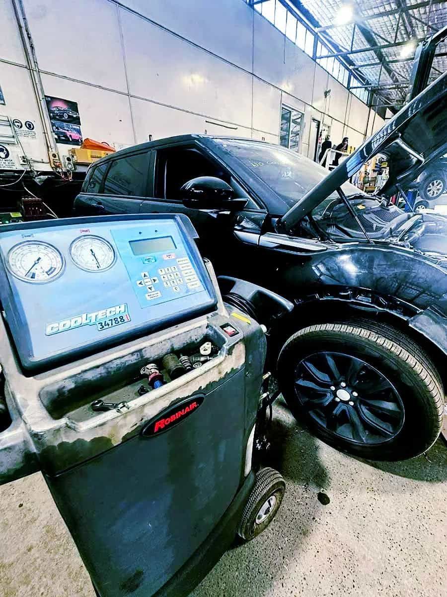 A Car Is Next To A Machine In A Garage — Manning Smash & Auto Repairs In Wingham, NSW